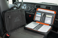 Waterproof document case for truck drivers open showing organized pockets on truck cab seat